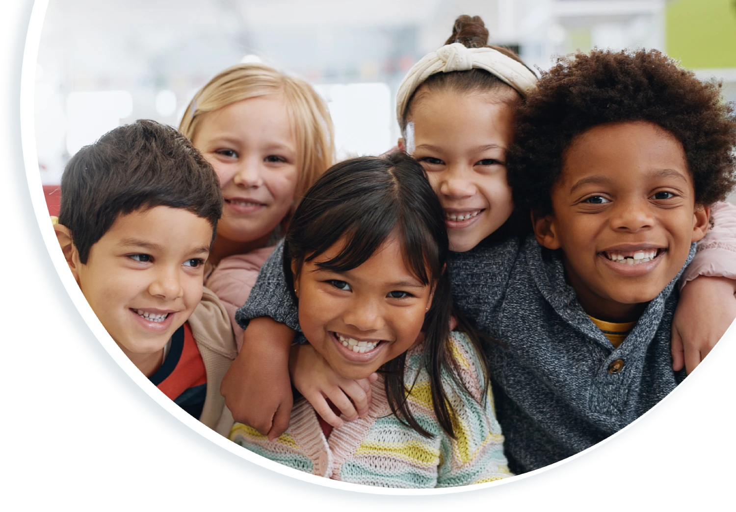 A group of children smiling for the camera.